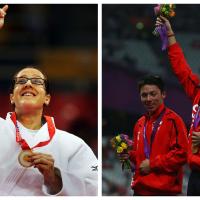 two para athletes celebrate with their gold medals on the podium