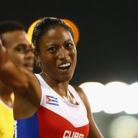 A female Para athlete celebrates after her race