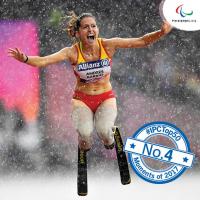 a female Para athlete dances in the rain