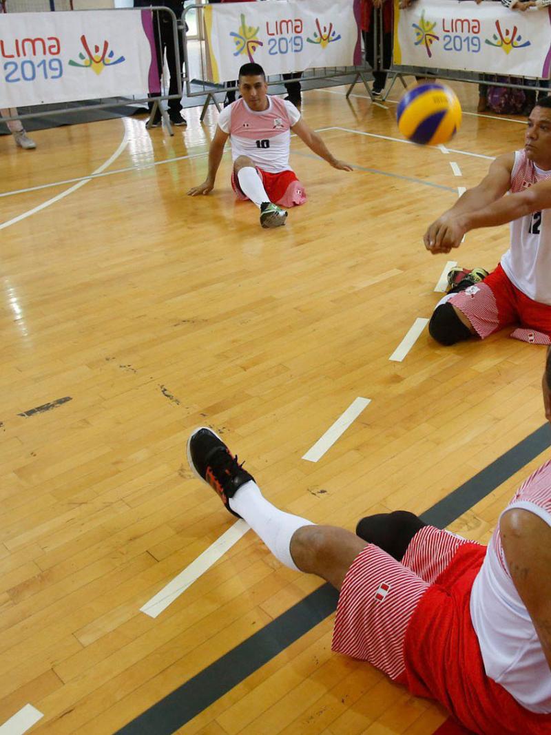 Peruvian sitting volleyball player Bruno Jose Quiros Davalos hits the ball