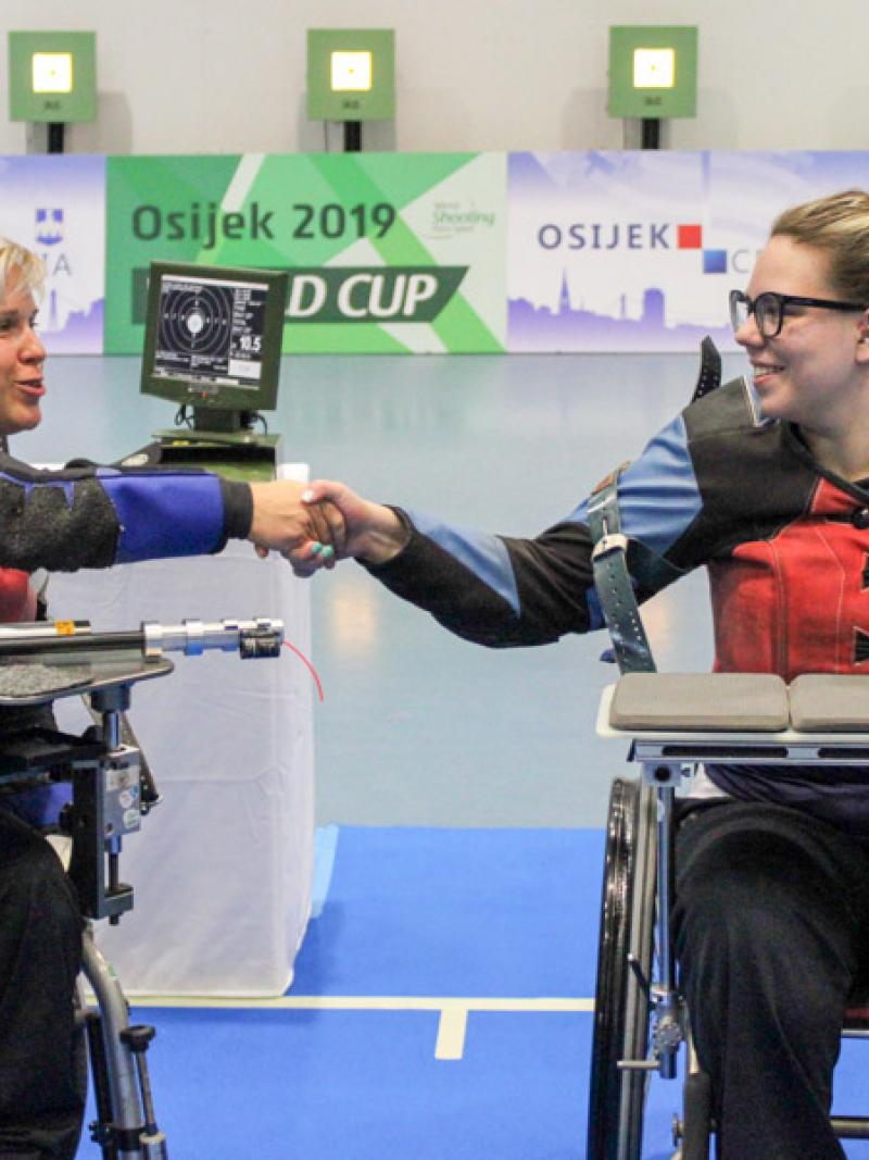 Veronika Vadovicova fist bumps athlete after winning gold.