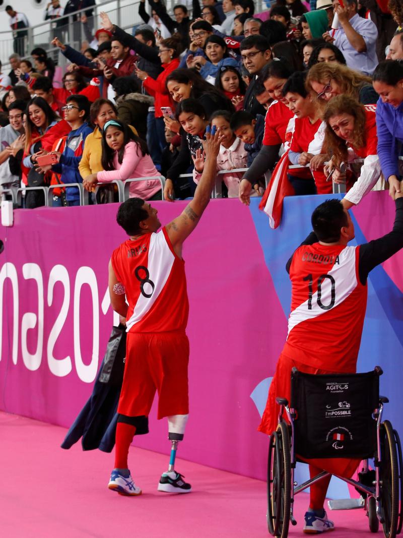 Peruvian sitting volleyball players cheered by the crowd