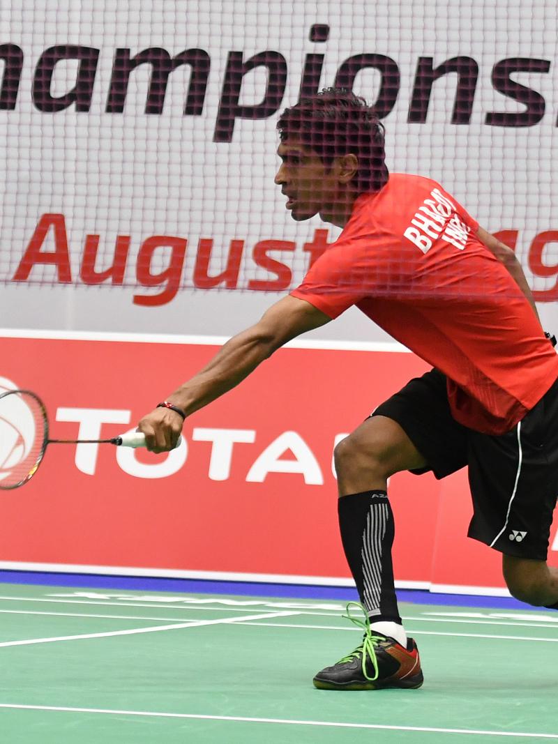 Indian badminton player lunches for a shot