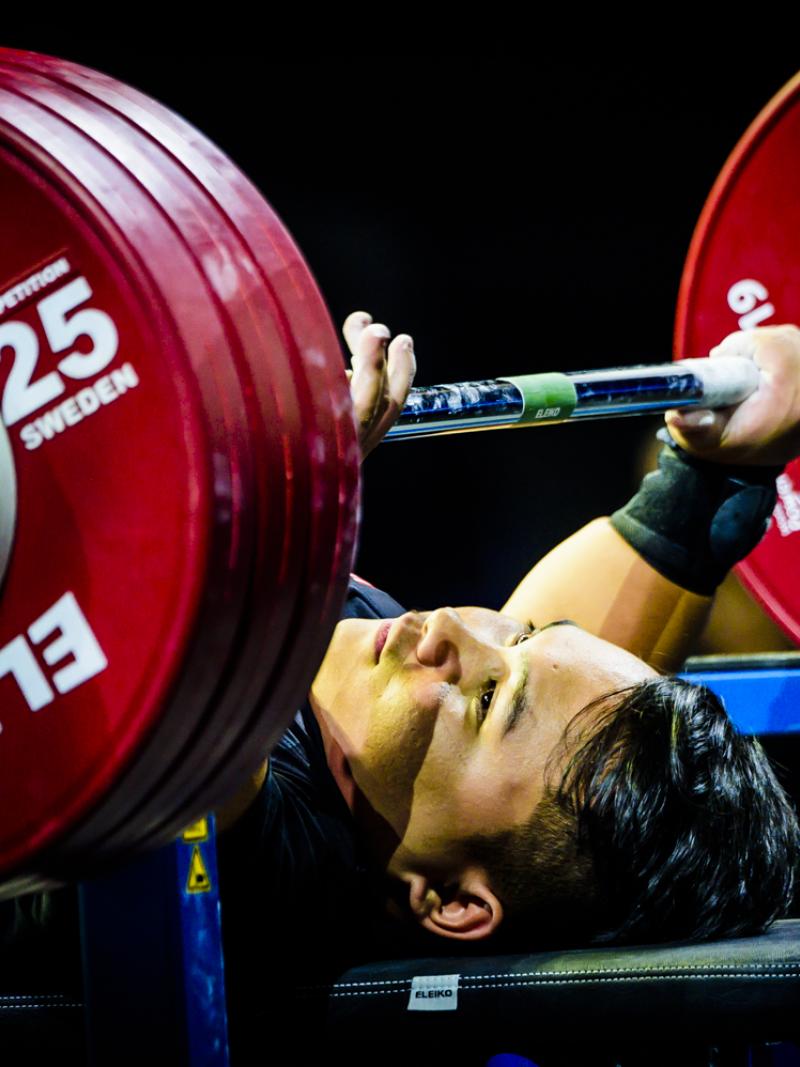 A male powerlifter preparing to lift the bar