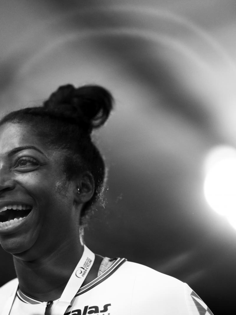 a female Para cyclist smiling