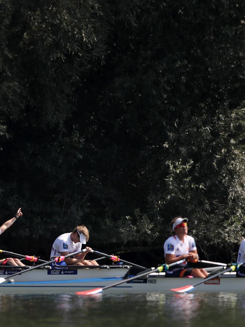 British rowing crew celebrates while Dutch rowing crew looks disappointed
