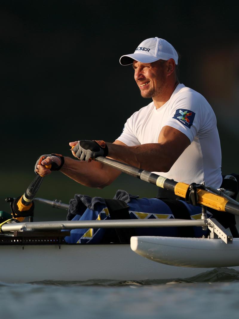 Man in row boat looks on