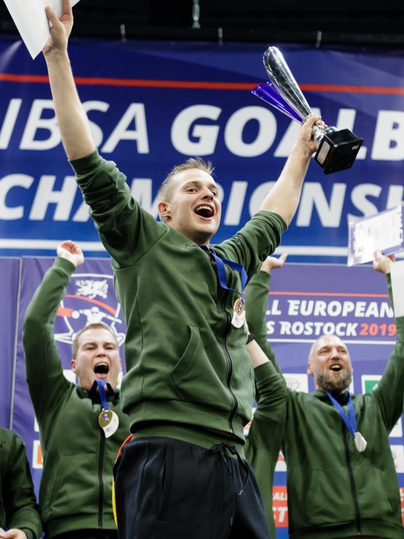 German players lift their arms in celebration