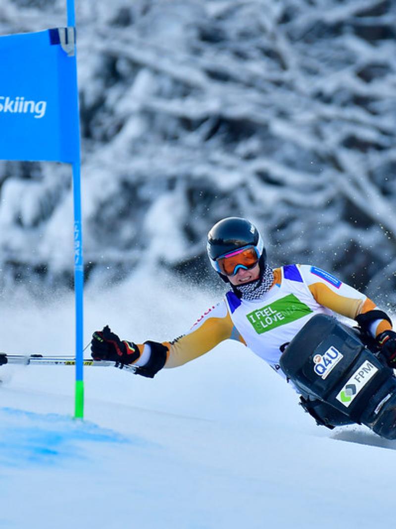 A female sit-skier competing