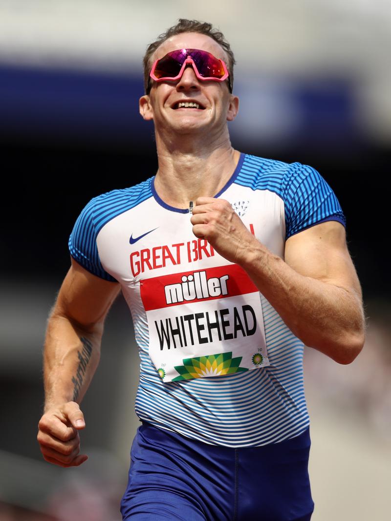 Richard Whitehead seeming tired while running towards the finish line