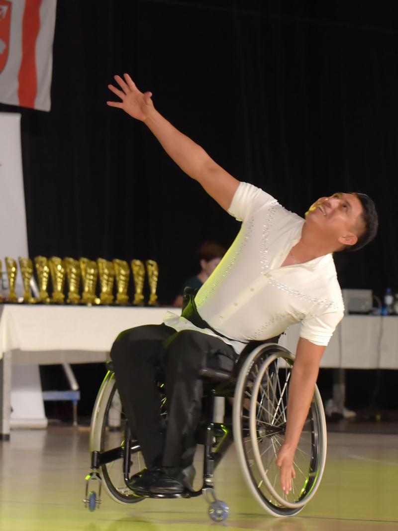 Mexican man in wheelchair dancing