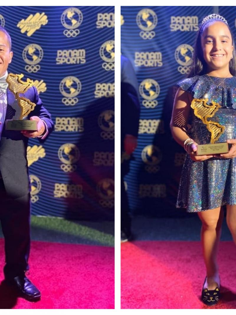 Herbert Aceituno and Sara Vargas hold their trophies
