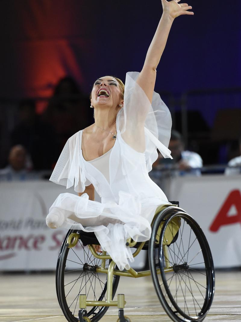 Woman in wheelchair performs expresses emotion in dance