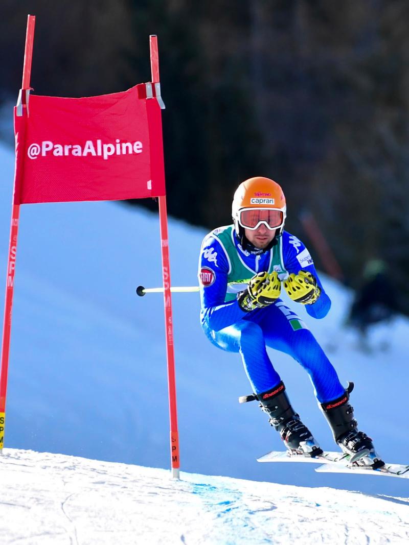 A man competing in Para alpine skiing