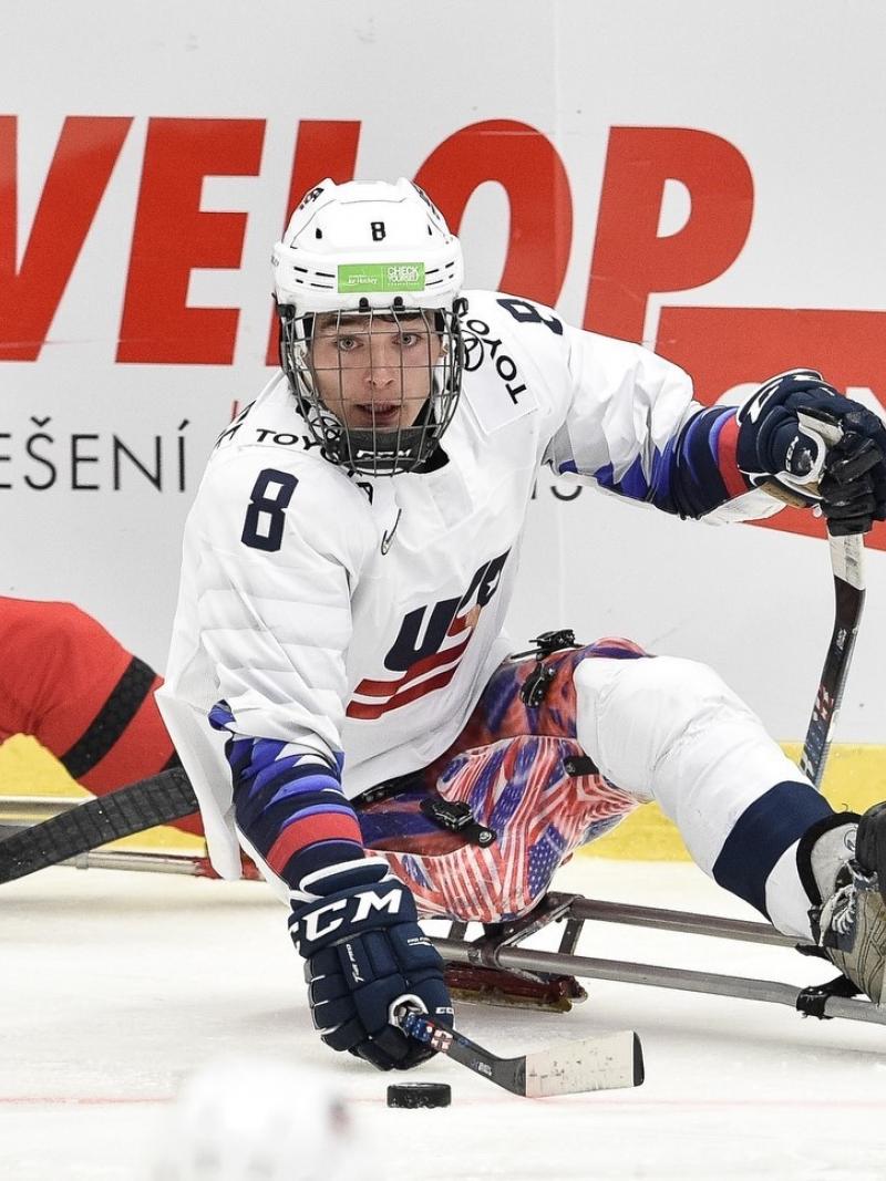 Two Para ice hockey players on the ice