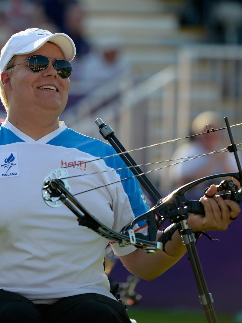 Finnish male archer celebrates after winning Paralympic gold