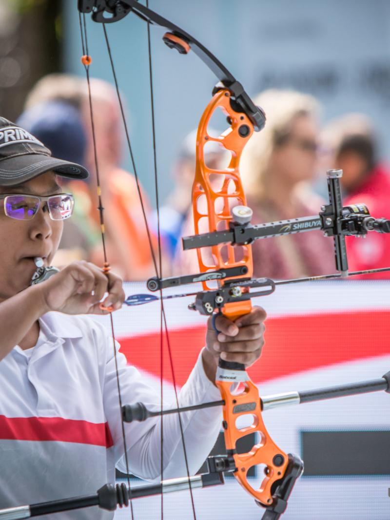 Signapore female archer prepares her bow and arrow