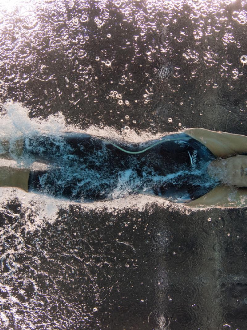An underwater image of a female Para swimmer with one leg