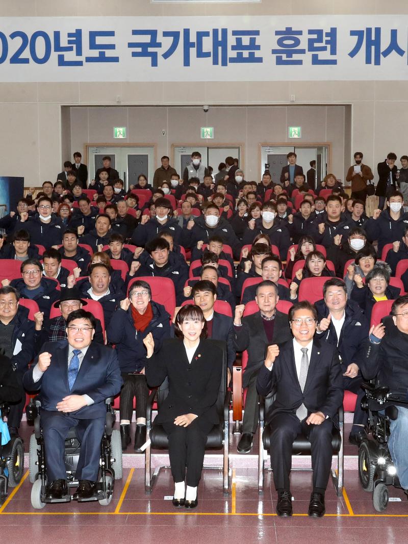 Group photo of athletes and staff at an initiation ceremony of a training centre