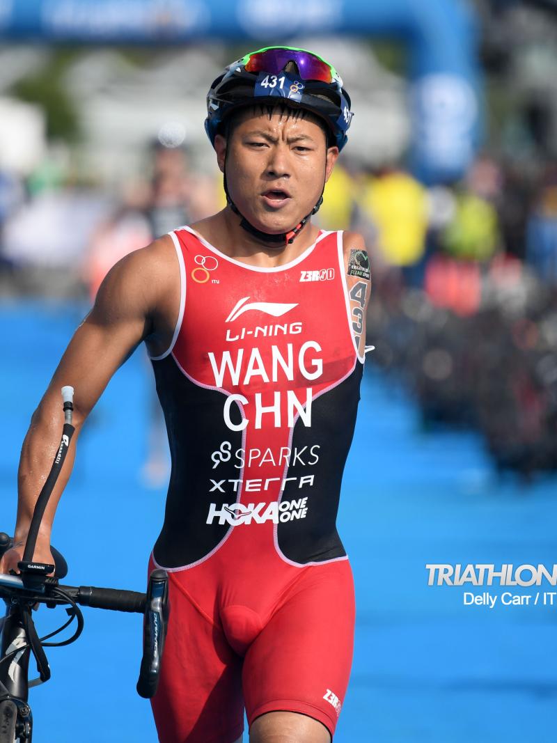 Chinese male with left arm amputation transitions to bike segment of triathlon