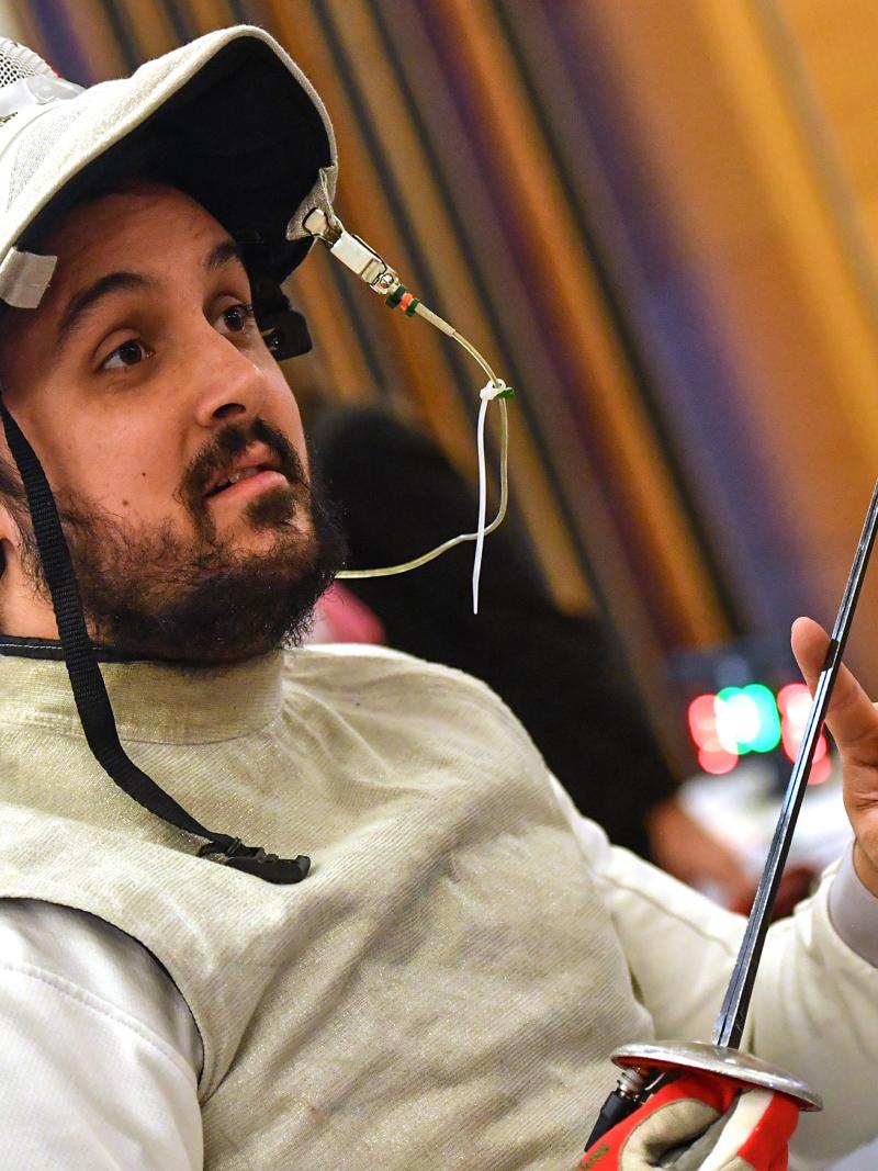 Male French wheelchair fencer with his helmet off