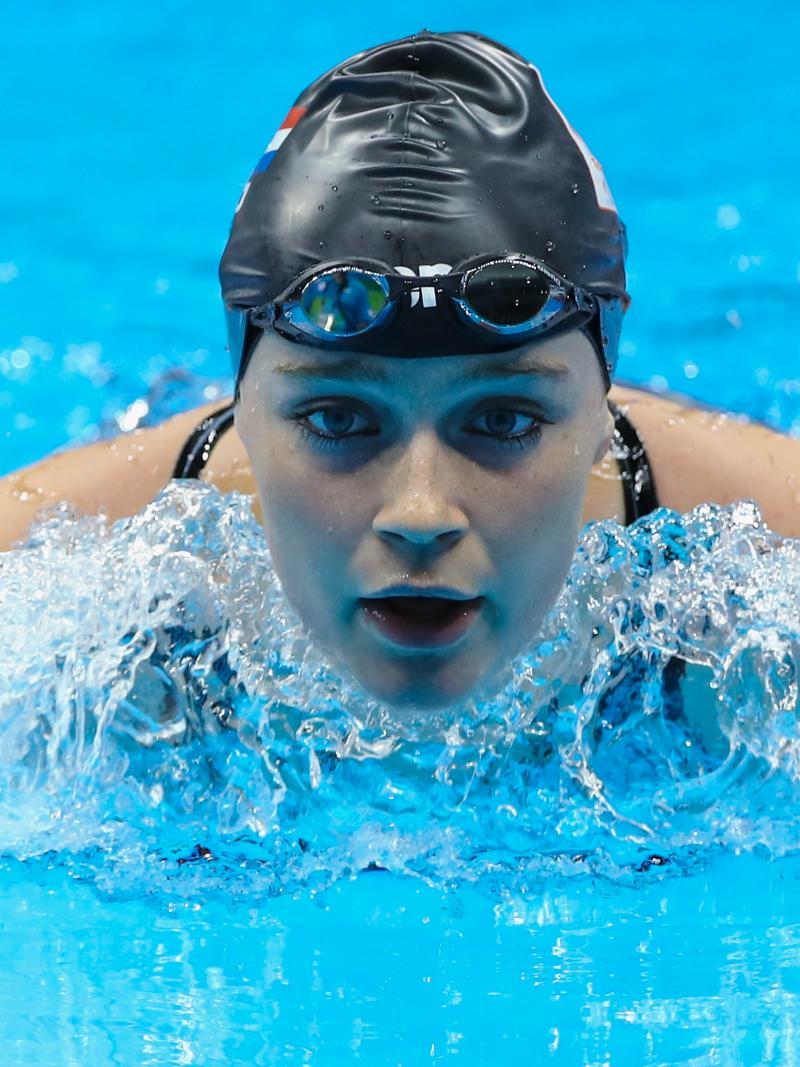 Female swimmer competing in the water