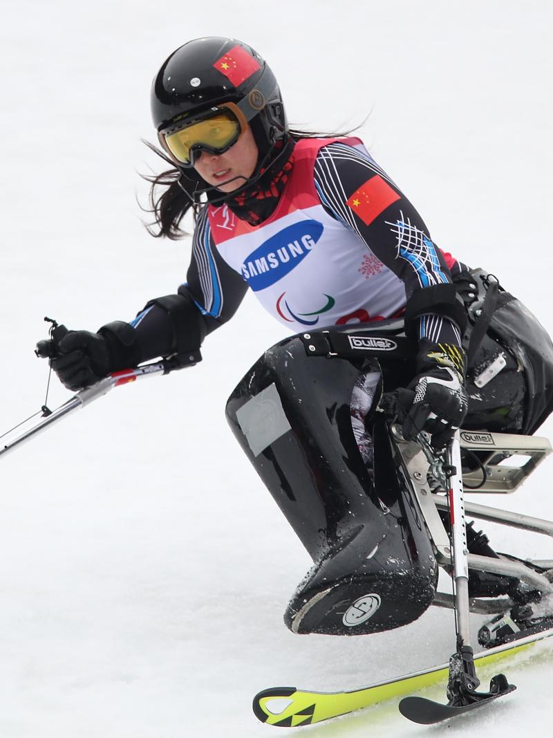 A female Para alpine sit-skier competing