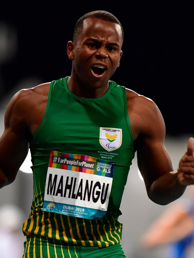 A male runner celebrating