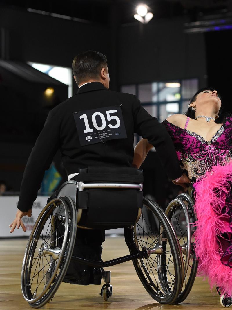 A couple in wheelchairs dancing