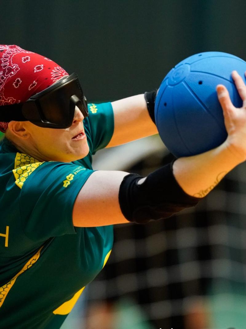 Female goalball player prepares to release the ball