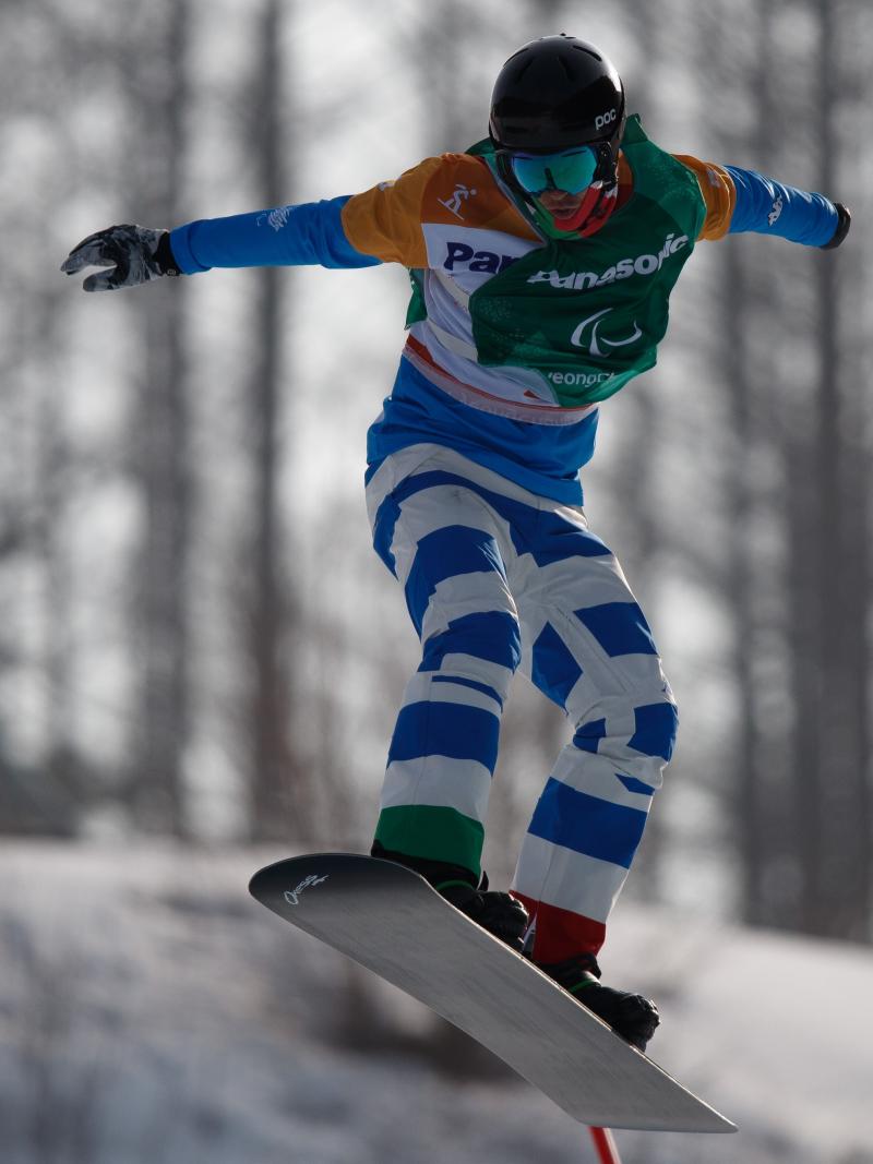 A man snowboarding