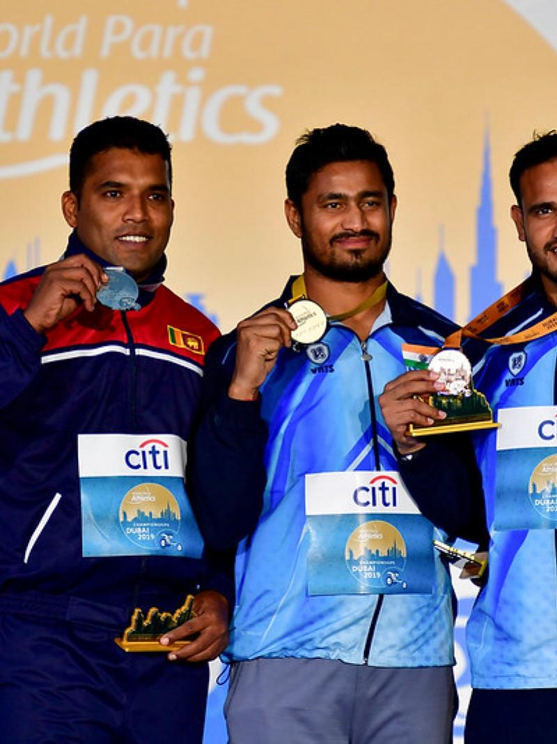Three male javelin throwers on the podium