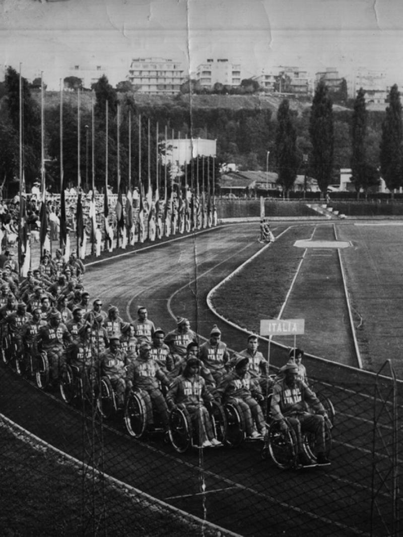 Old black and white photo of Italy marching into the stadium
