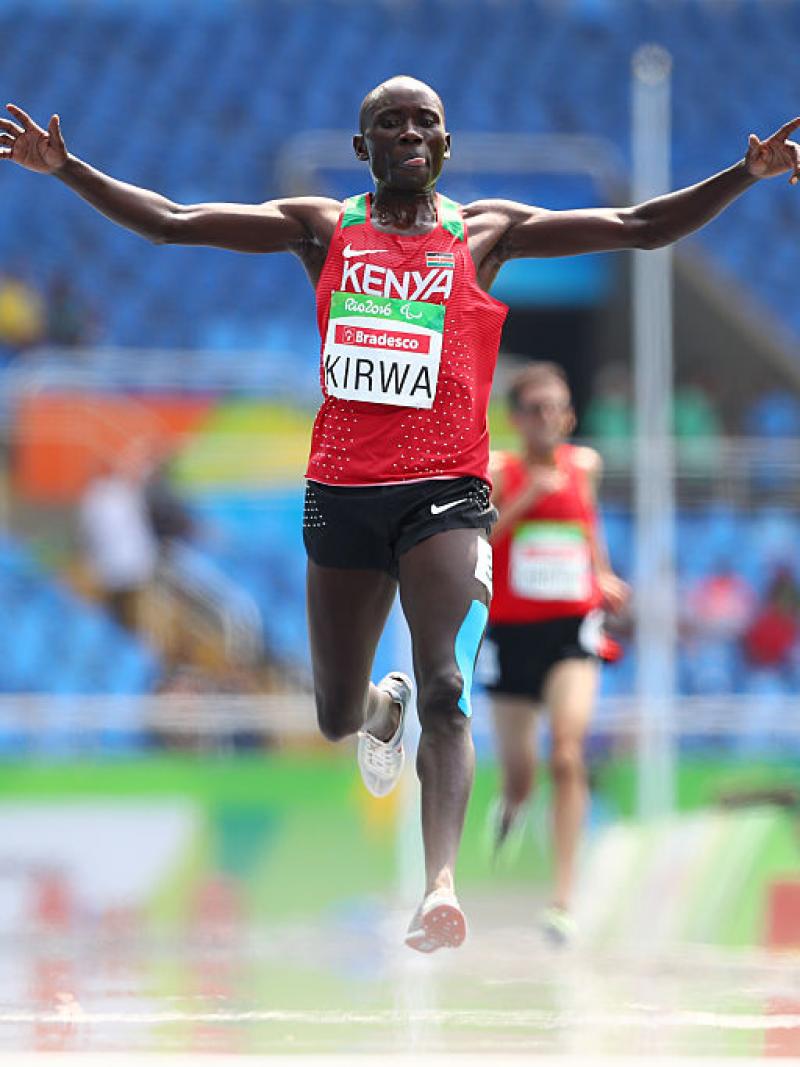 Photo of Kenya runner celebrating after crossing the finish line