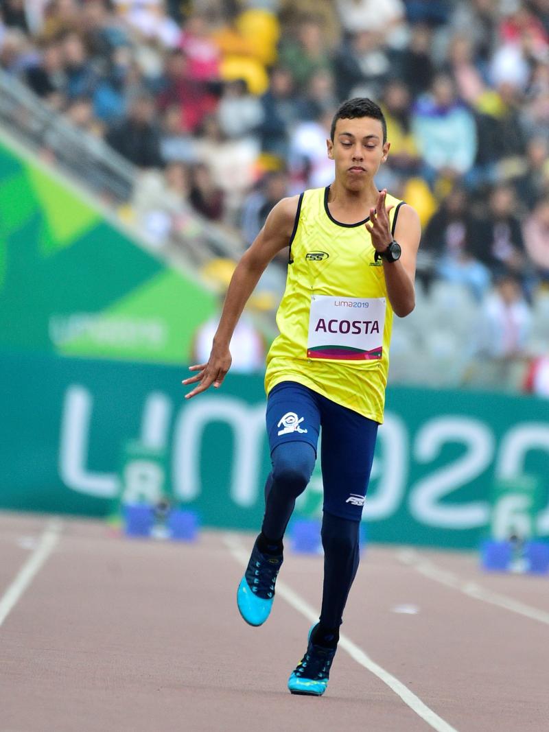 Colombian male athlete sprinting on the track