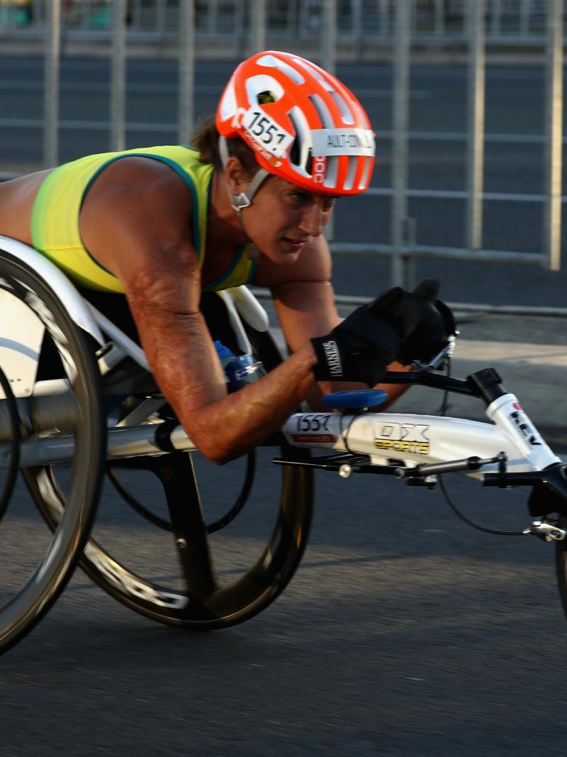 Female wheelchair racer competing