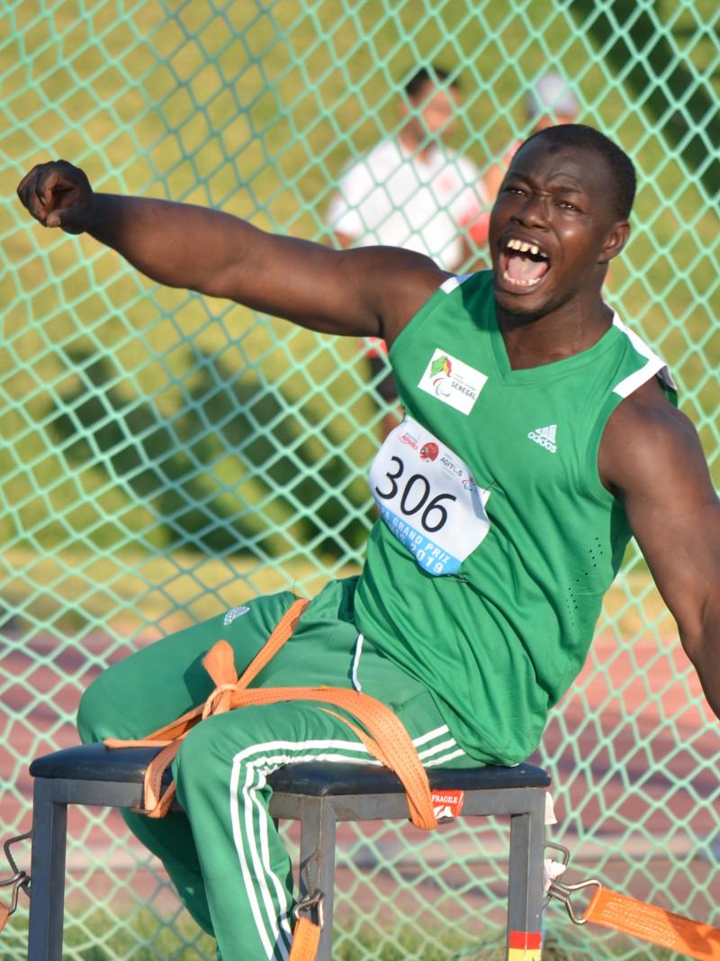 Black man yells after releasing discus