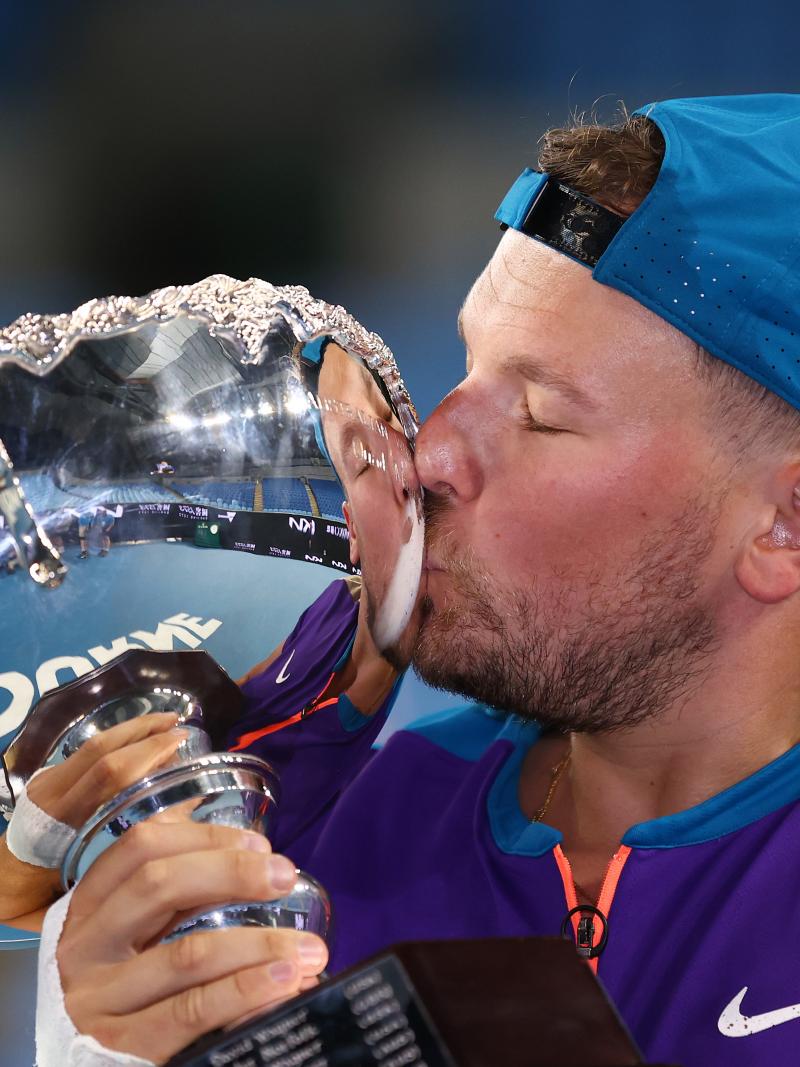Dylan Alcott kisses Australian Open trophy