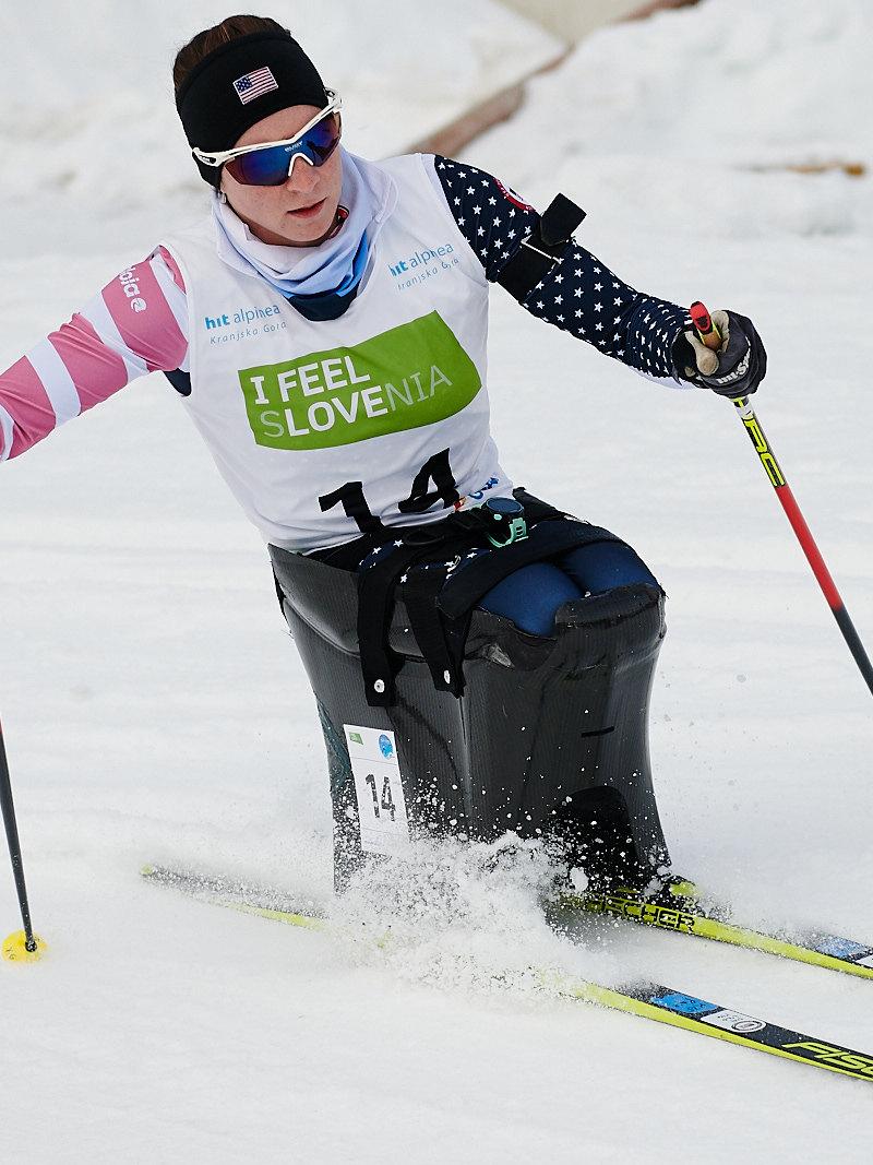 A female sit-skier in a cross-country competition 