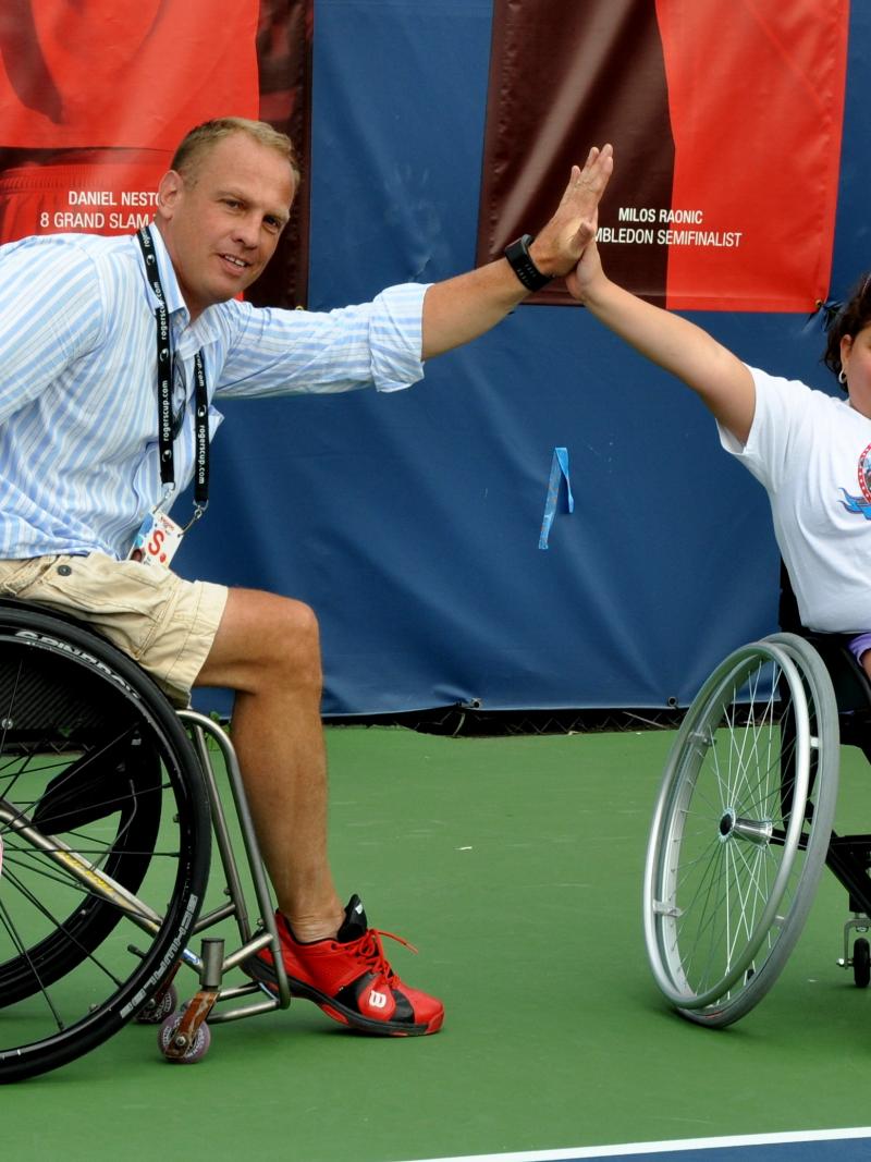 Kai Schrameyer high-fives a kid