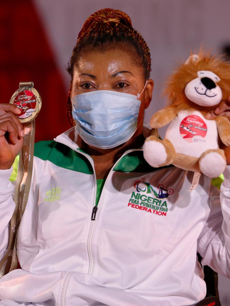 Lucy Ejike poses with her gold medal after winning in Manchester