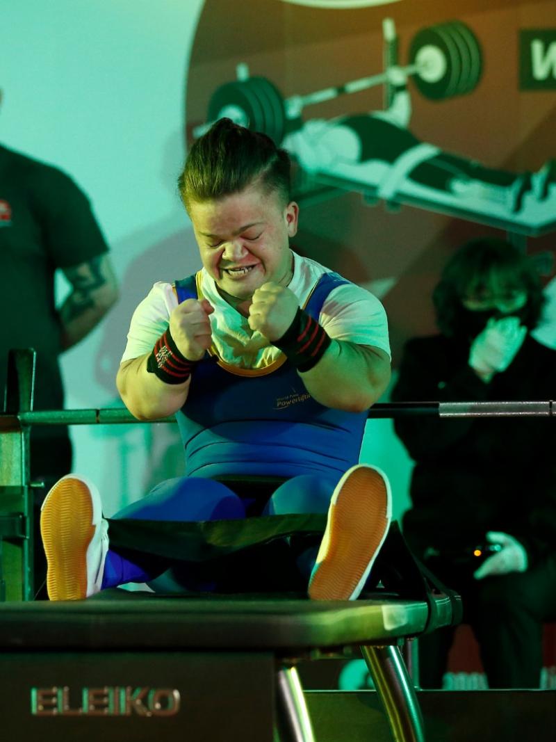 Mariana Shevchuk celebrates after successfully lifting the bar