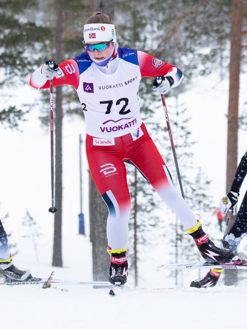 Vilde Nilsen competing in cross country skiing alongside other two women athletes