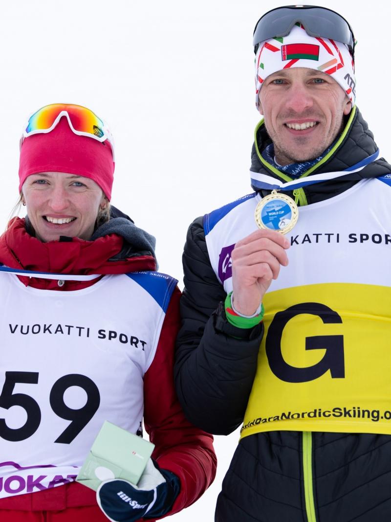 Belarus’ Sviatlana Sakhanenka and her guide Dzmitry Budzilovich at the podium at Vuokatti 2021 World Cup