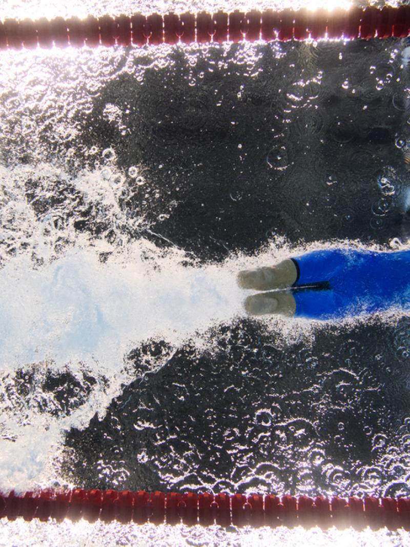 An underwater image of a female swimmer without legs