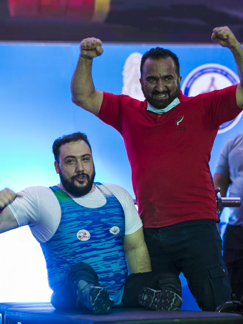 Roohallah Rostami celebrates with his coach