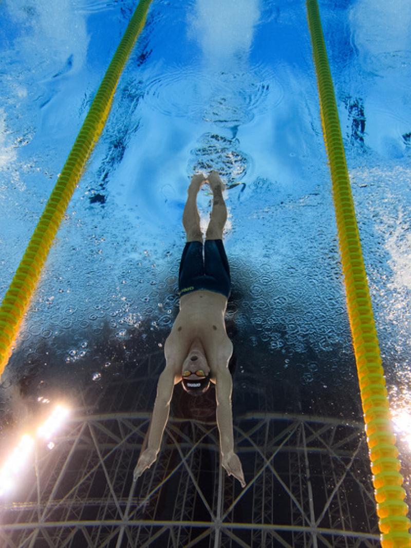 An underwater image of three male Para swimmers