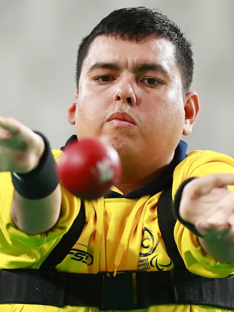 Colombia male boccia player throws the ball