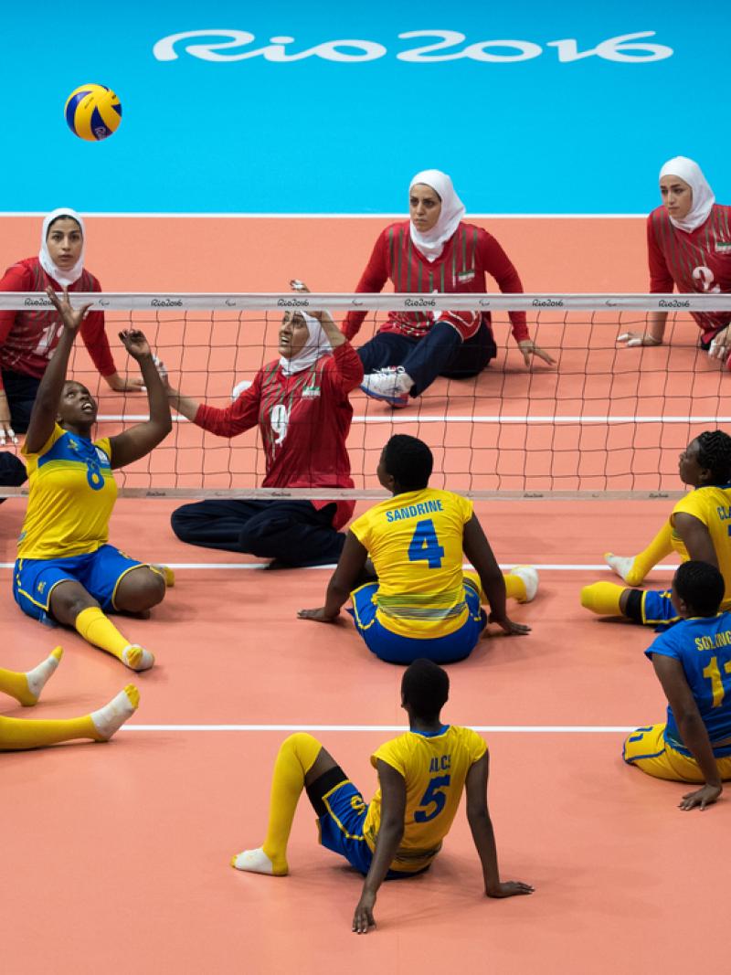 Rwandan and Iranian women's sitting volleyball teams competing