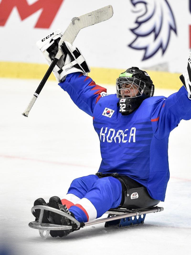A Korean Para ice hockey goaltender celebrating on ice